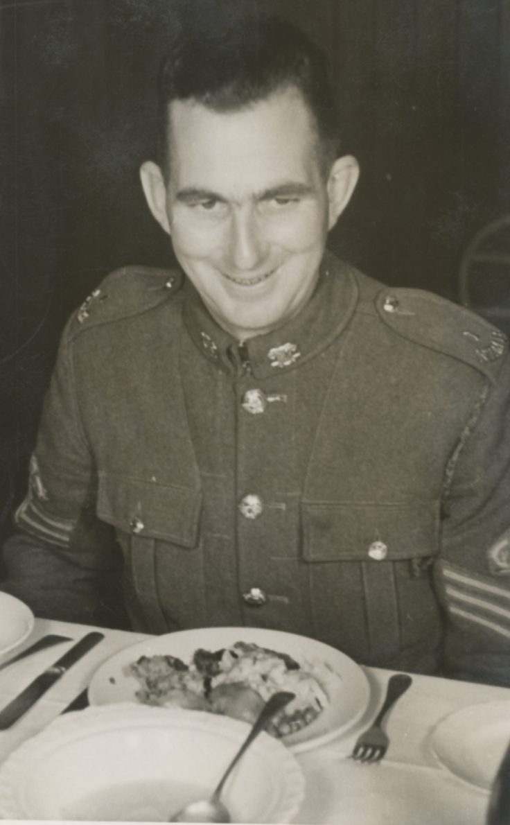 1. An unknown soldier enjoying a plate of roast - the classic kiwi meal..png